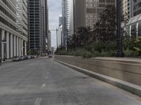 city buildings are along a quiet road with a signpost to point out the lights