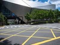 a building that has a yellow painted lines on the street by it's curb