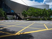 a building that has a yellow painted lines on the street by it's curb