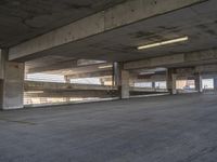 a parking garage full of cars and empty spaces to move forward through and off the car park