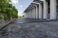 the walkway between two columns is made from pebbles and stone tiles to allow additional walkwaying