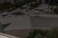 this view looks like an outdoor city plaza with black and white painted arrows on it