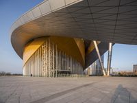 the large structure in the middle of the walkway has been designed like a wave to a curved