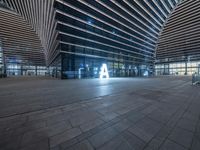 there is a photo of a modern building by itself and is empty of people or any work