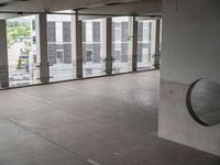 a view from inside an empty building of an empty room with metal accents around the area