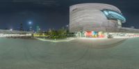 this is the circular lens view of the building taken at night time and time lapsing