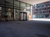 the entrance to an office building has been opened up in front of it's glass doors