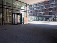 the entrance to an office building has been opened up in front of it's glass doors