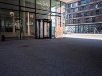 the entrance to an office building has been opened up in front of it's glass doors