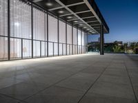 a big building that is built into the ground with glass on the roof and sides