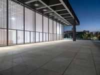 a big building that is built into the ground with glass on the roof and sides