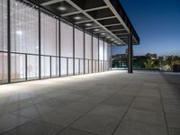 a big building that is built into the ground with glass on the roof and sides