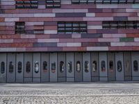 there is an image of an outside building with glass windows on the side of it