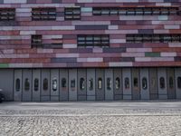 there is an image of an outside building with glass windows on the side of it