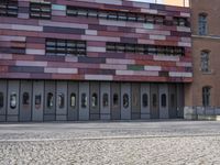 there is an image of an outside building with glass windows on the side of it
