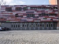 there is an image of an outside building with glass windows on the side of it