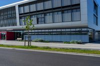 an empty street and an office building in the distance on a clear day in europe