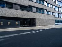 the entrance to a large building with the word perigo on it in the middle of the street