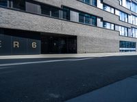 the entrance to a large building with the word perigo on it in the middle of the street