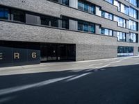 the entrance to a large building with the word perigo on it in the middle of the street