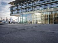 a large building that has windows that are outside in a city place of different shapes