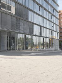 the building is very large and has a lot of windows and no doors to protect from the sun