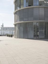 the building is very large and has a lot of windows and no doors to protect from the sun