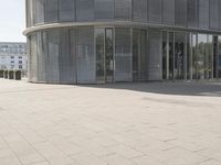 the building is very large and has a lot of windows and no doors to protect from the sun