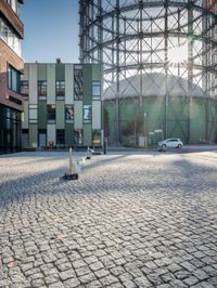 the building has a square shape with many windows and a number of stairs in front of it
