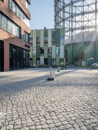 the building has a square shape with many windows and a number of stairs in front of it