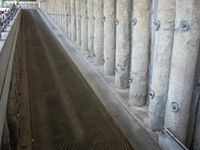 the floor area of a large water storage with a small pipe coming out of it