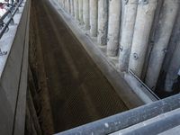 the floor area of a large water storage with a small pipe coming out of it