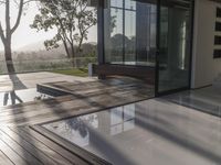 there are many steps on the ground by this house that has two large glass doors