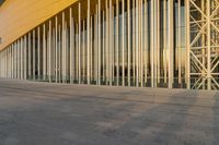 a very large building made up of several columns with many windows and bars on the side