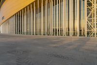 a very large building made up of several columns with many windows and bars on the side