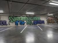 a large room with graffiti on the wall and a ramp in the background that reads supremeord