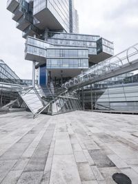 several stairs inside of some glass building with a person taking a picture with their camera