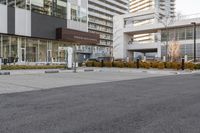 a parking meter in the middle of an empty paved road and surrounded by a city street