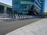 a bridge that goes over the street to go by the building on the other side