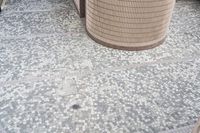 there is a square bathroom floor with a round tiled floor and tiled shower stall in the foreground