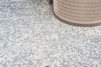 there is a square bathroom floor with a round tiled floor and tiled shower stall in the foreground