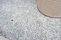 there is a square bathroom floor with a round tiled floor and tiled shower stall in the foreground