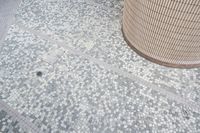 there is a square bathroom floor with a round tiled floor and tiled shower stall in the foreground