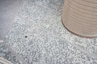 there is a square bathroom floor with a round tiled floor and tiled shower stall in the foreground