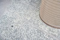 there is a square bathroom floor with a round tiled floor and tiled shower stall in the foreground