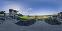 a 360 view of the view of a green lawn from below the house, and steps leading up to the first floor