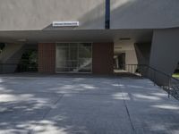 an exterior view of a building with a sign in front of it saying, welcome home