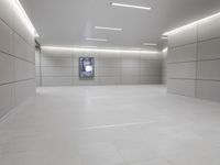 a white floor has tile and lights lit by recesses in an empty room on the wall