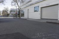 the road by the building is marked with the words in chalk to describe the area to be located on