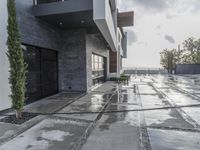 a building with snow on the ground and one of them sticking out of the door